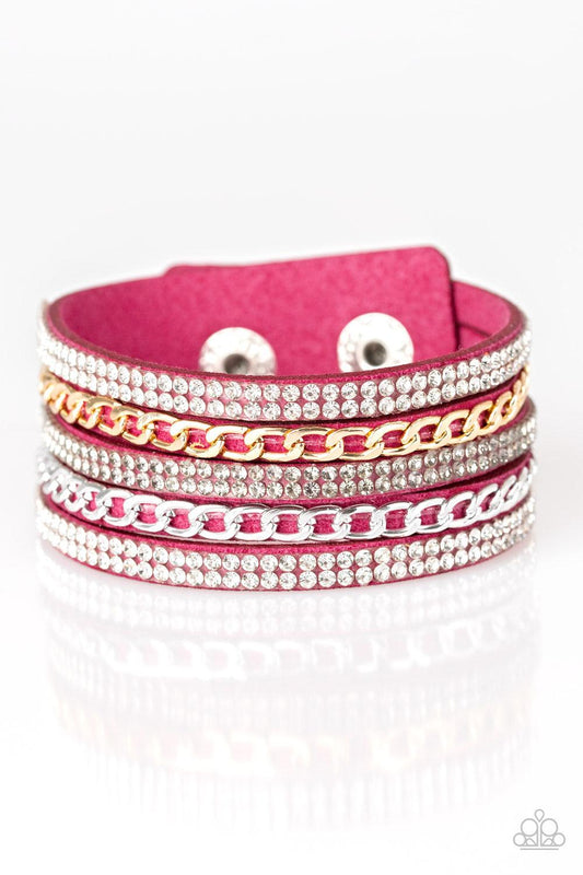 Paparazzi Accessories Fashion Fiend - Pink Glassy white and smoky rhinestones are encrusted along strands of pink suede. Glistening silver and gold chains are added to the bands, adding edgy industrial shimmer to the sassy palette. Features an adjustable