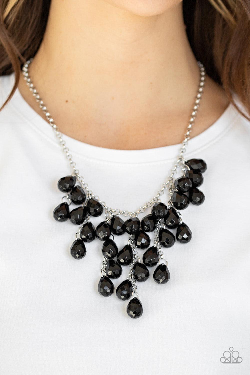 Paparazzi Accessories Serenely Scattered - Black Strands of faceted black teardrops cascade from the bottom of a shimmery silver chain, creating a scattered fringe below the collar. Features an adjustable clasp closure. Sold as one individual necklace. In
