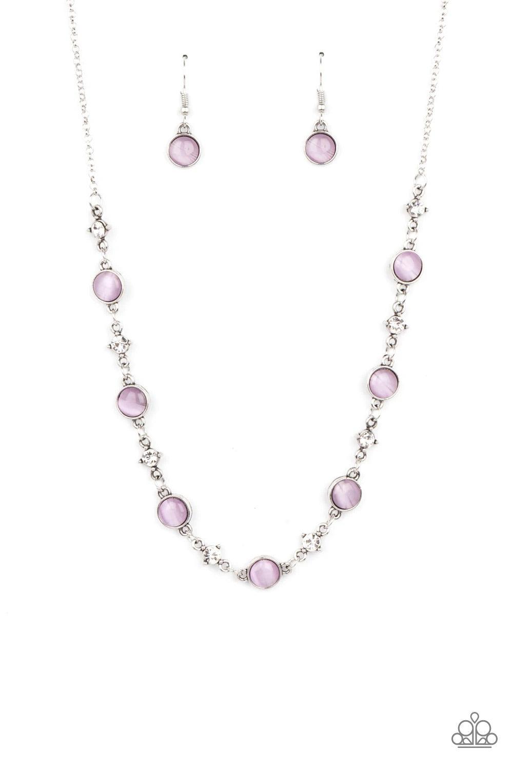 Paparazzi Accessories Inner Illumination - Purple Encased in antiqued silver fittings, dainty white rhinestones and glowing Amethyst Orchid cat's eye stones delicately link below the collar for a timeless finish. Features an adjustable clasp closure. Sold