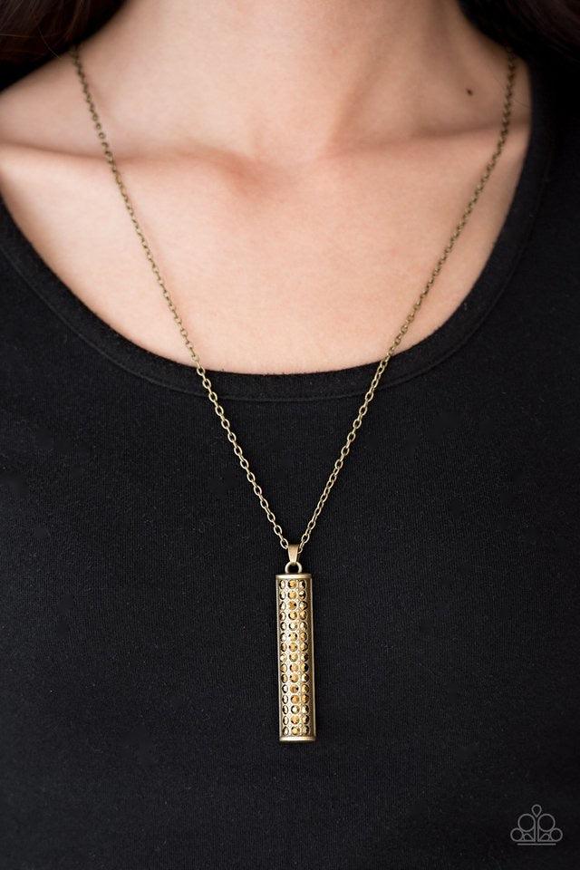 Paparazzi Accessories Big Shot Shimmer - Brass Featuring a rounded edge, a shimmery brass pedant is encrusted in rows of glittery aurum rhinestones for a dramatic look. Features an adjustable clasp closure. Sold as one individual necklace. Includes one pa