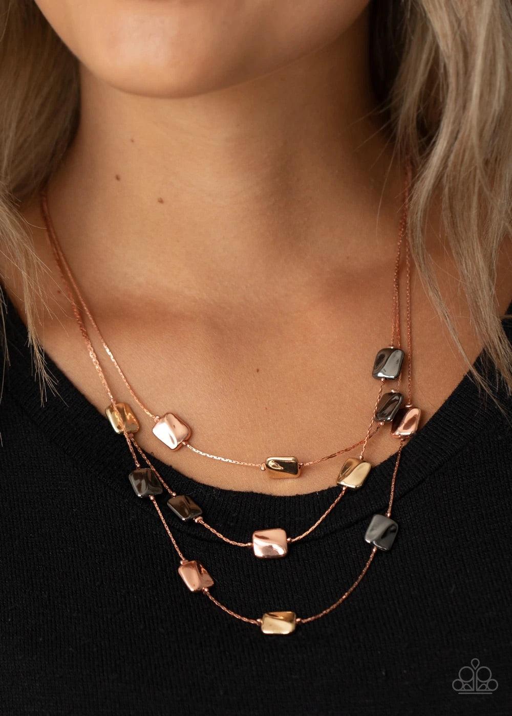 Paparazzi Accessories Downtown Reflections - Copper Featuring a decorative surface, dainty shiny copper, gunmetal, and gold rectangular accents are fitted in place along three sleek shiny copper chains, creating refined layers below the collar. Features a