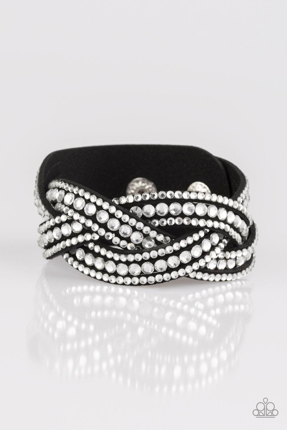 Paparazzi Accessories Bring On The Bling - Black Varying in size, glassy white rhinestones are encrusted along interwoven black suede bands, creating blinding shimmer across the wrist. Features an adjustable snap closure. Sold as one individual bracelet.