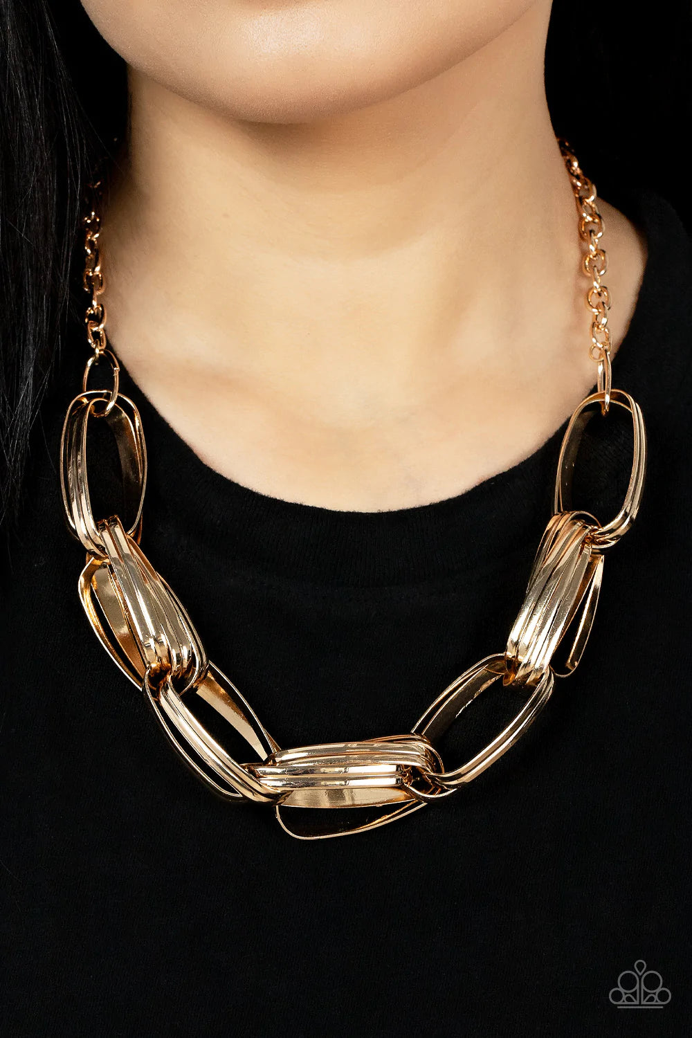 Paparazzi Accessories Fiercely Flexing - Gold Brushed in an antiqued shimmer, pairs of oversized oval gold links dramatically connect into a gritty chain below the collar for a bold industrial look. Features an adjustable clasp closure. Sold as one indivi
