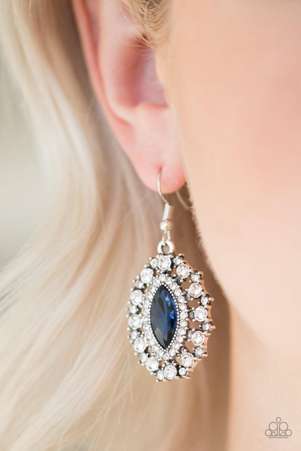 Paparazzi Accessories Long May She Reign - Blue Featuring a regal marquise style cut, a glittery blue rhinestone is pressed into a studded silver frame radiating with glassy white rhinestones for a timeless look. Earring attaches to a standard fishhook fi