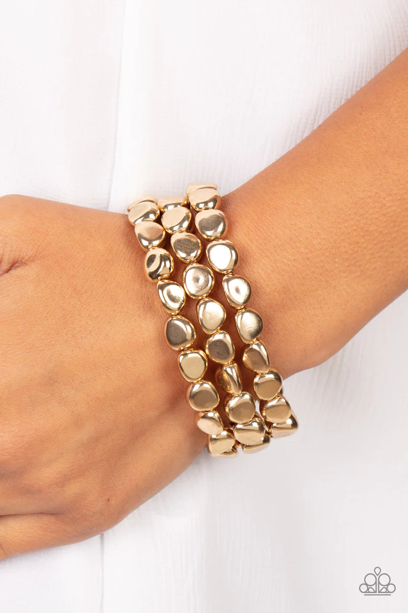 Paparazzi Accessories HAUTE Stone - Gold Featuring irregular stone shapes, a shiny series of gold beads are threaded along stretchy bands around the wrist for a bold pop of monochromatic magic. Sold as one set of three bracelets. Jewelry
