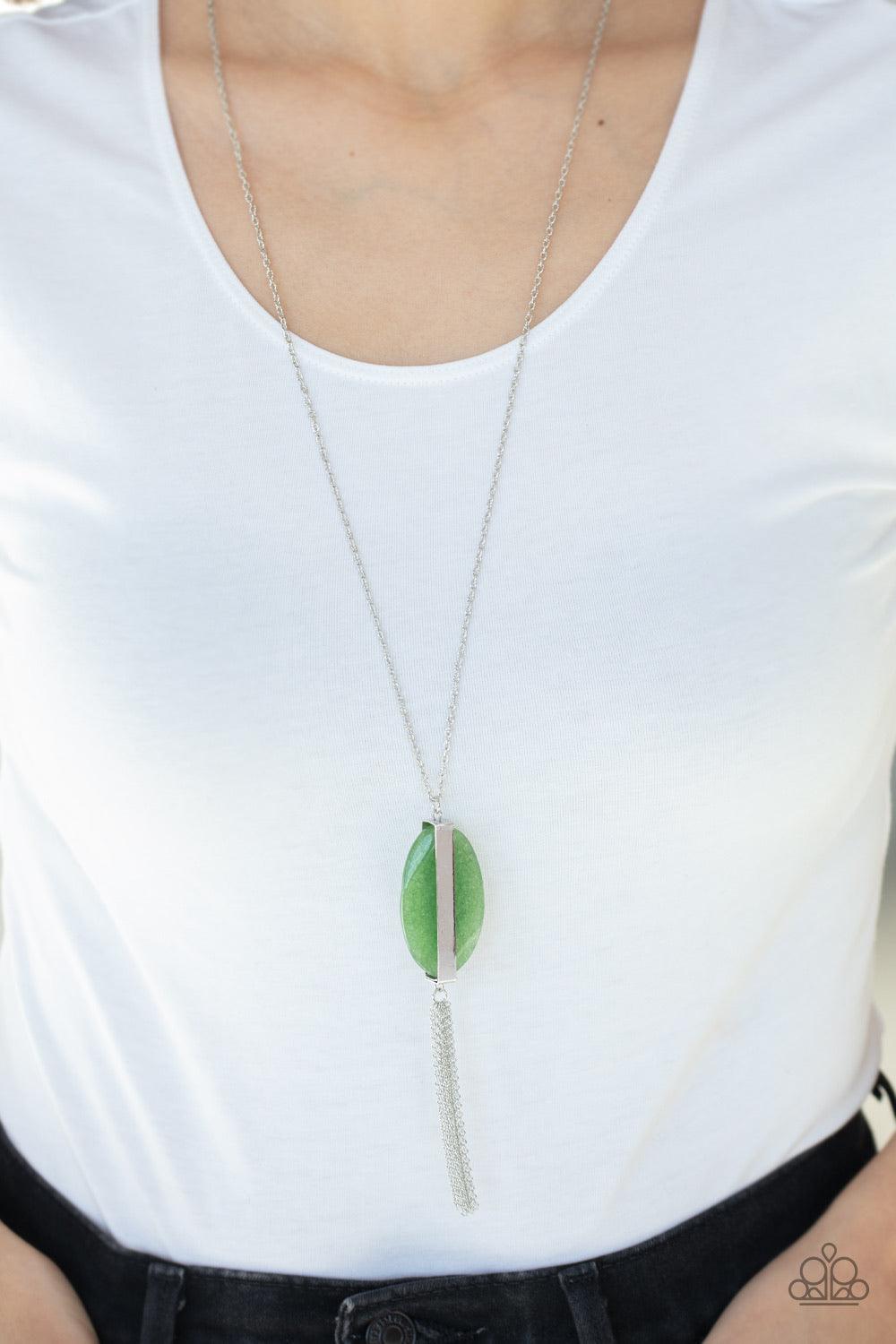 Paparazzi Accessories Tranquility Trend - Green Threaded through a rod, an earthy green stone sits inside a rectangular silver fitting, giving way to a shimmery silver chain tassel for a tranquil finish. Features an adjustable clasp closure. Jewelry