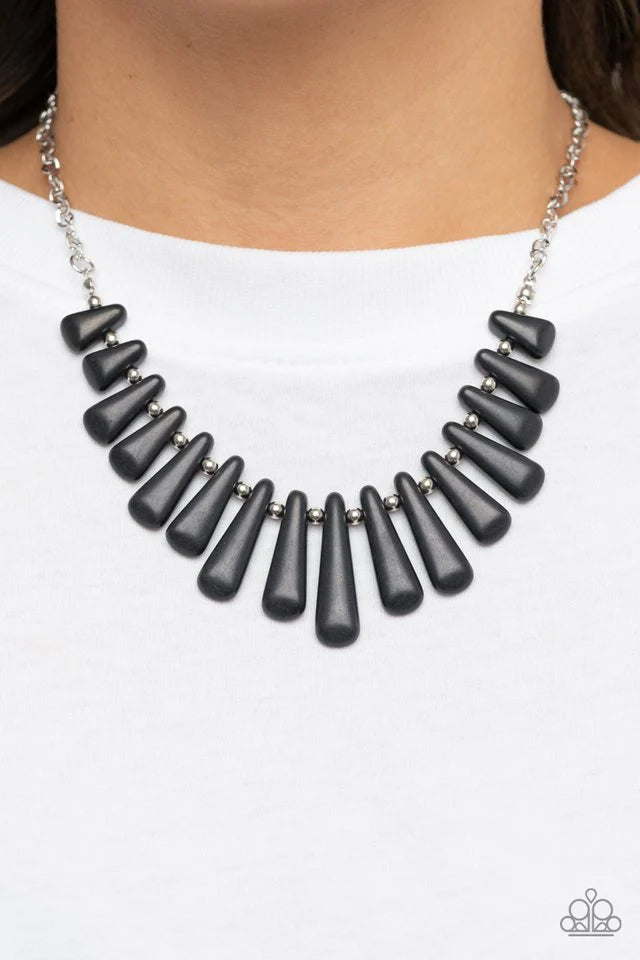 Paparazzi Accessories Mojave Empress - Black Separated by dainty silver beads, pieces of triangular cut black stones gradually increase in size as they fan out below the collar for an earthy statement. Features an adjustable clasp closure. Sold as one ind