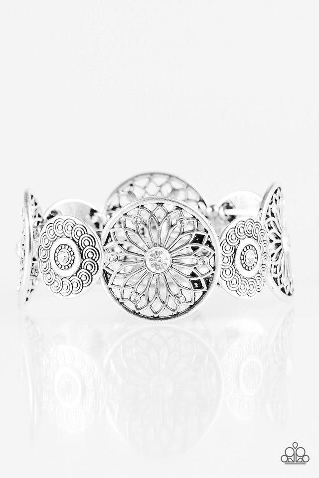 Paparazzi Accessories Love Wheel Find A Way - White Dotted in glittery white rhinestone centers, mismatched silver frames are threaded along elastic stretchy bands, creating a decorative shimmer around the wrist. Sold as one individual bracelet. Jewelry