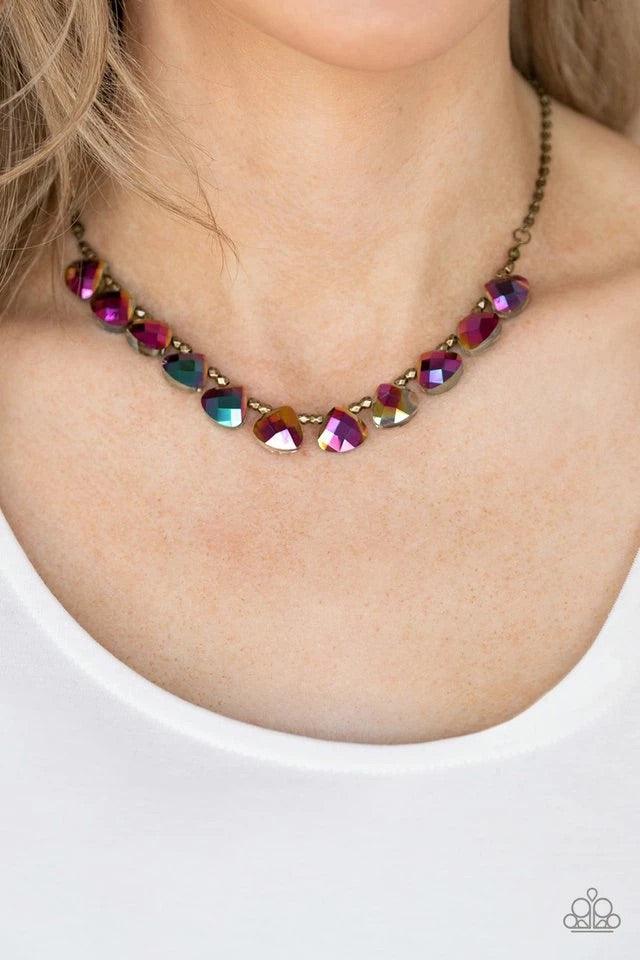 Paparazzi Accessories Catch A Fallen Star - Brass Featuring a metallic oil spill finish, rounded teardrops join pairs of faceted brass beads below the collar for an ethereally refined look. Features an adjustable clasp closure. Sold as one individual neck