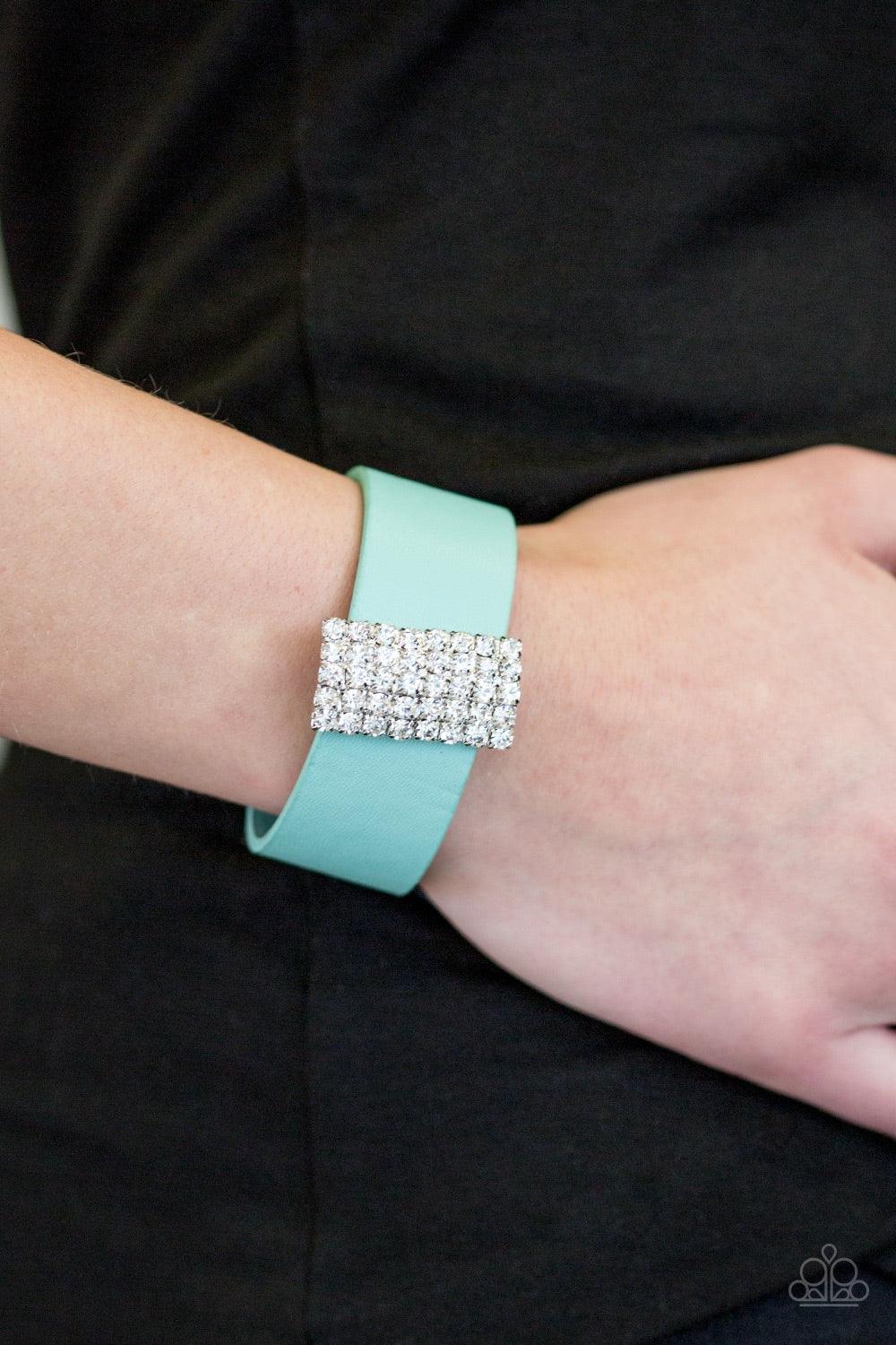 Paparazzi Accessories Walk The CATWALK - Green Encrusted in glittery white rhinestones, a sparkling frame slides along a strip of green leather, creating a blinding centerpiece. Features an adjustable snap closure. Jewelry