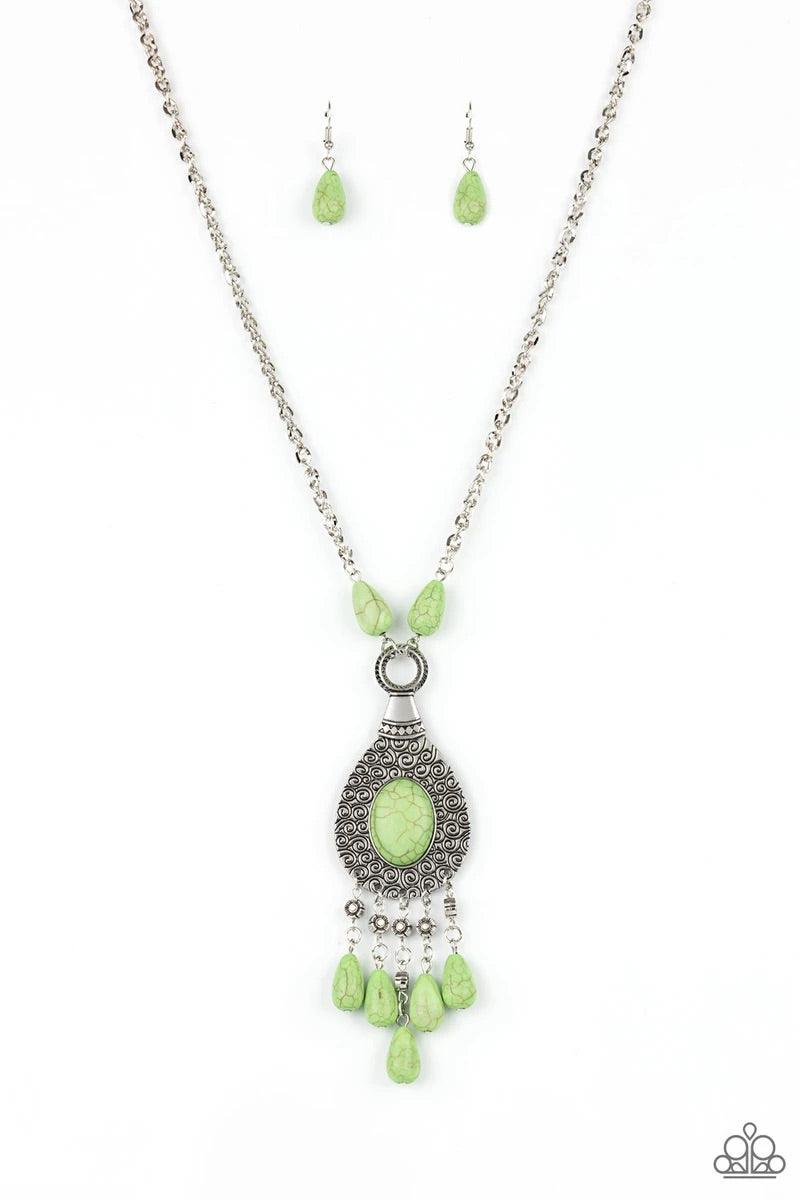 Paparazzi Accessories Cowgirl Couture - Green An Apple Green oval stone sits center stage surrounded by swirly designs stamped into a wide silver frame. A fringe of silver floral beads culminating in Apple Green stones swings like a pendulum at the end of