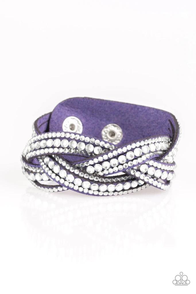Paparazzi Accessories Bring on the Bling - Blue Varying in size, glassy white rhinestones are encrusted along interwoven blue suede bands, creating blinding shimmer across the wrist. Features an adjustable snap closure. Sold as one individual bracelet. Je