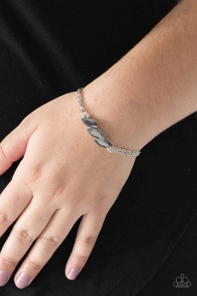 Paparazzi Accessories Pretty Priceless - Silver Featuring regal marquise-cuts, a trio of glittery hematite rhinestones join across the center of the wrist for a timeless look. Features an adjustable clasp closure. Sold as one individual bracelet. Jewelry