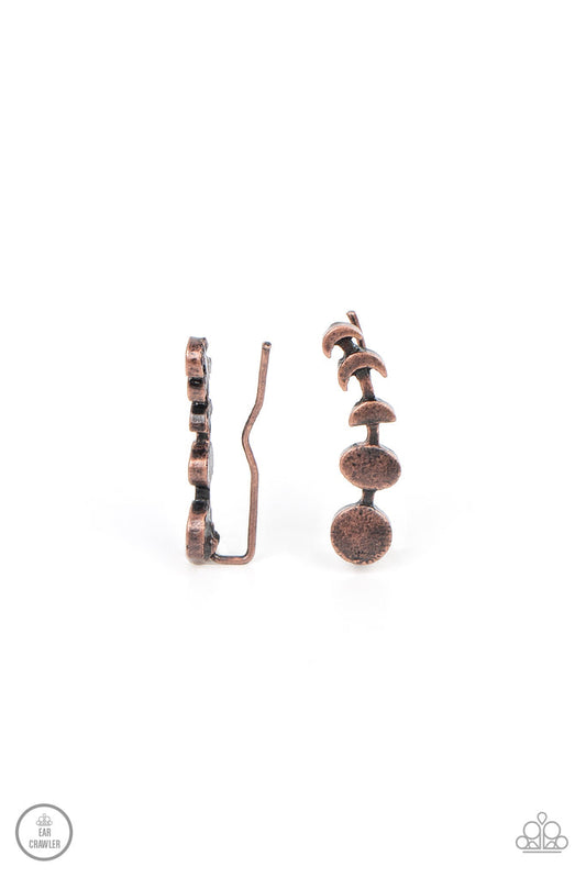 Paparazzi Accessories It’s Just a Phase - Copper A dainty copper bar displays the phases of the moon as it curls across the ear for a stellar look. Features an extended post fitting that climbs the back of the ear and can be pressed together for a more se