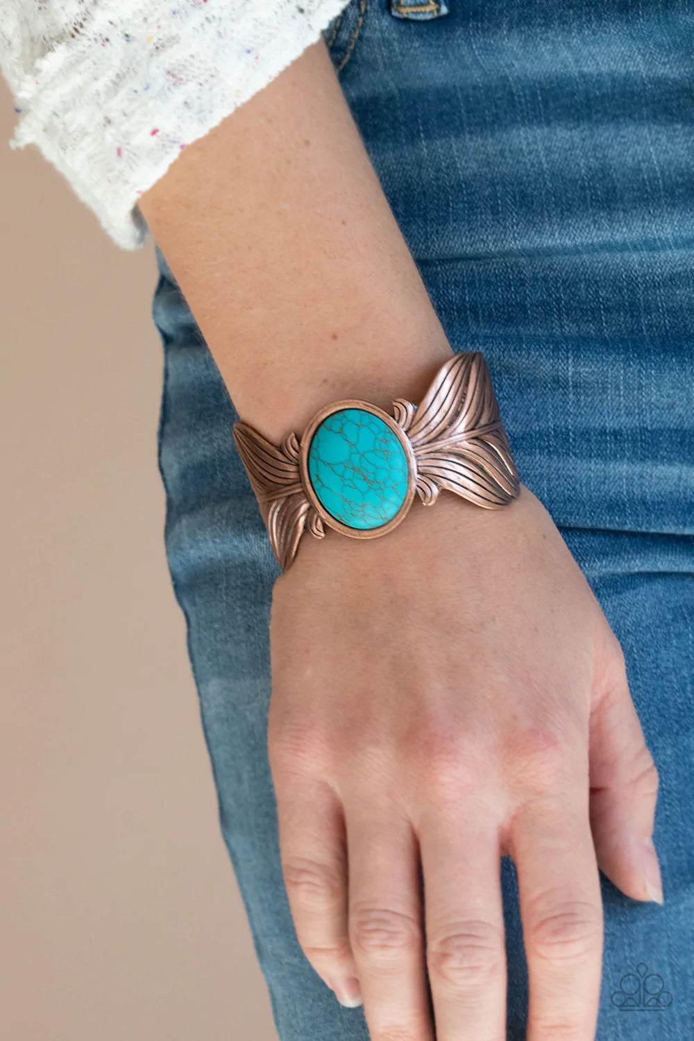 Paparazzi Accessories Born to Soar - Copper Etched and embossed in lifelike textures, two oversized copper feathers branch out from a refreshing turquoise stone center, curling into a whimsical cuff around the wrist. Sold as one individual bracelet. Jewel