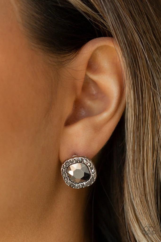 Paparazzi Accessories Bling Tastic - Silver Featuring a regal square-cut, a glittery hematite gem is pressed into a frame radiating with glassy hematite rhinestones for a timeless flair. Earring attaches to a standard post fitting. Sold as one pair of pos