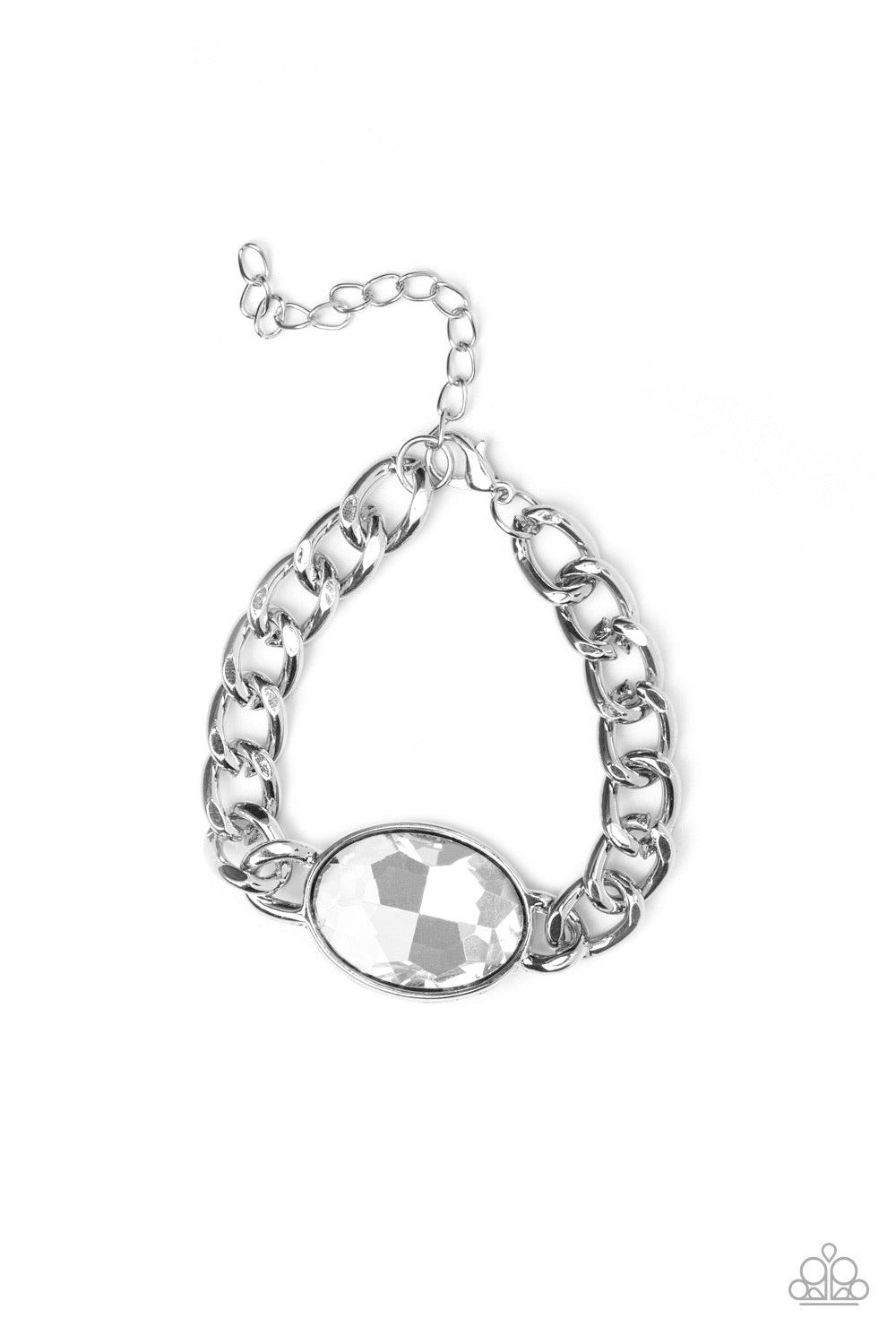 Paparazzi Accessories Luxury Lush - White An oversized white gem attaches to a bold silver chain, creating a dramatic centerpiece atop the wrist. Features an adjustable clasp closure. Jewelry