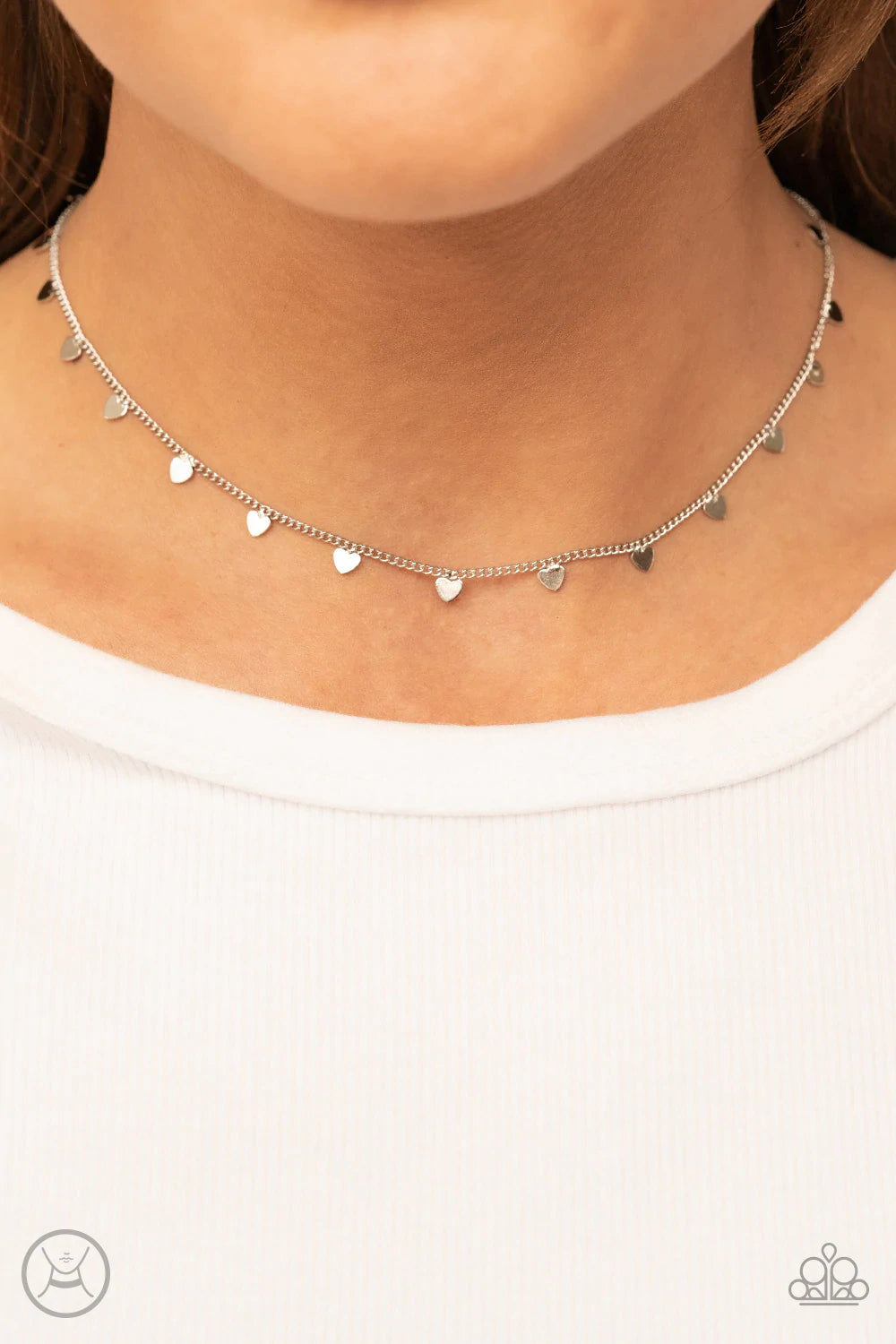 Paparazzi Accessories Cupid’s Cutest Valentine - Silver Dainty silver hearts dance from a dainty silver chain around the neck, creating a flirtatious fringe. Features an adjustable clasp closure. Sold as one individual choker necklace. Includes one pair o