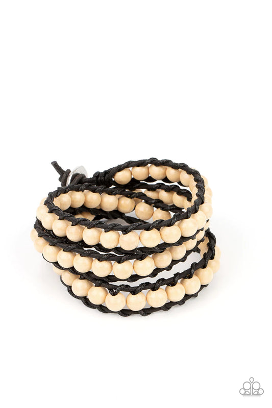 Paparazzi Accessories Pine Paradise - White A row of white wooden beads are knotted in place along two black leather cords, creating multiple earthy layers around the wrist with its extended length. Features an adjustable button loop closure. Sold as one