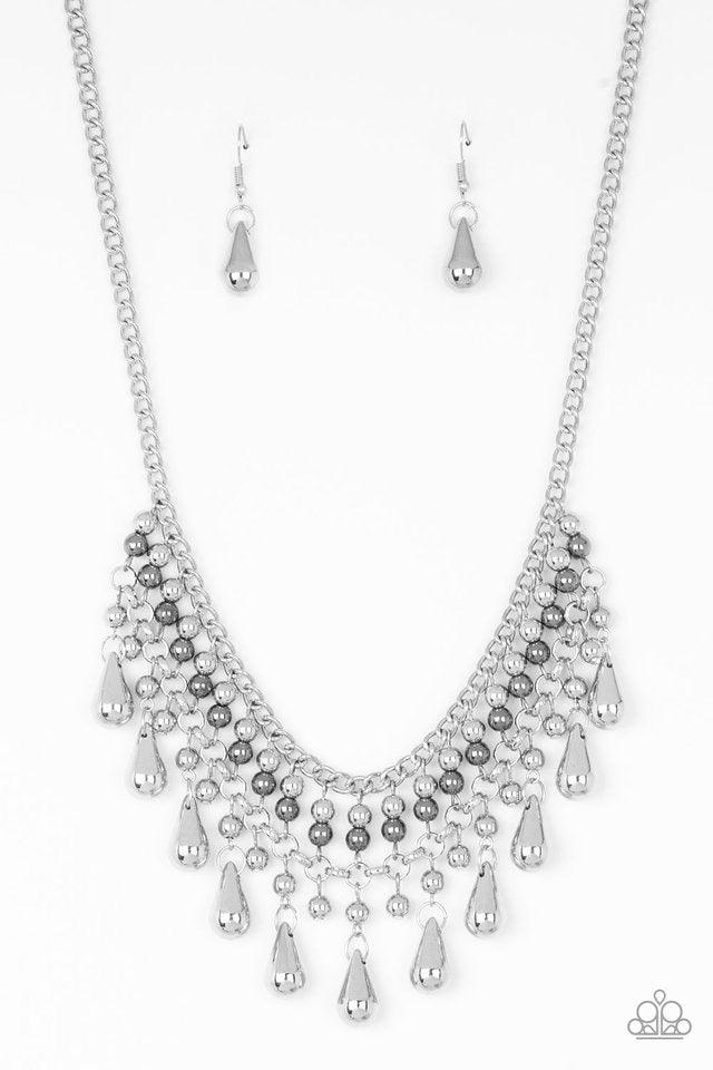 Paparazzi Accessories Don’t Forget To BOSS! - Silver Threaded along metallic rods, stacked silver and gunmetal beads give way to shimmery silver teardrops. The edgy fringe flawlessly drapes beneath the collar, creating a sassy tapered fringe. Features an