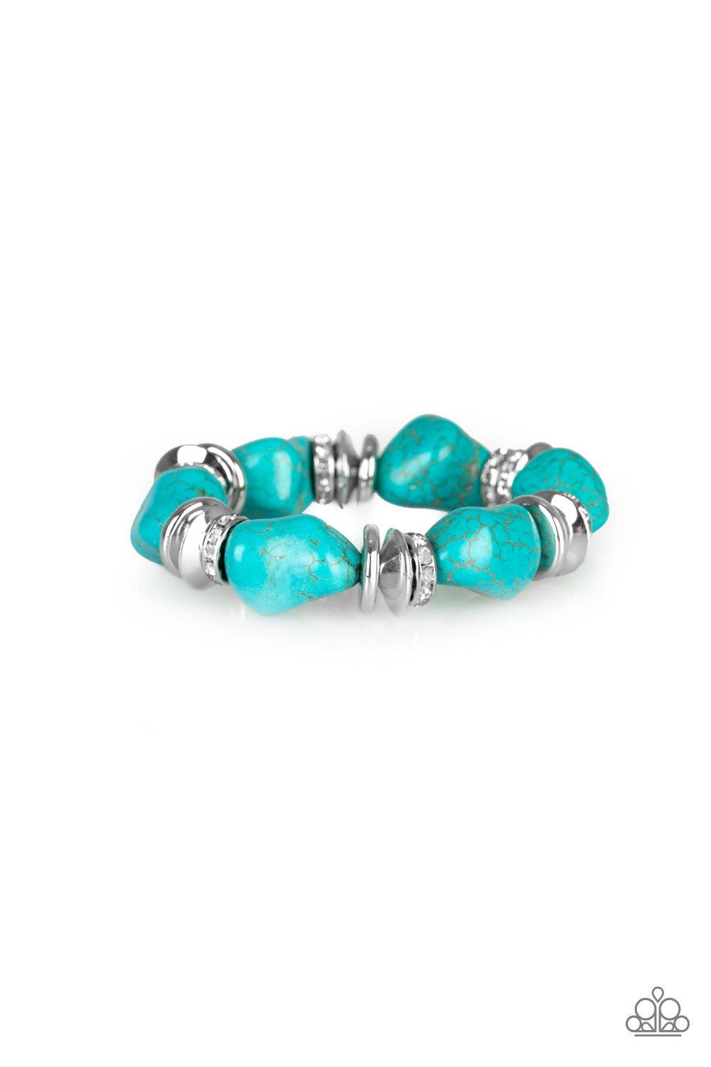 Paparazzi Accessories Stone Age Stunner - Blue A collection of refreshing turquoise stones, shimmery silver accents, and white rhinestone encrusted rings are threaded along a stretchy band around the wrist for a seasonal look. Jewelry