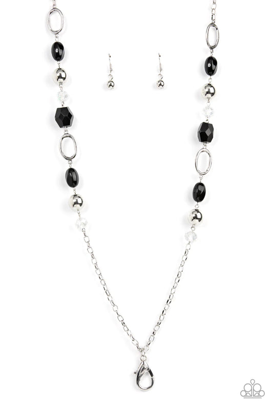 Paparazzi Accessories Vivid Variety - Black *Lanyard Featuring smooth, faceted, and polished finishes, a mismatched assortment of classic silver beads, sparkly crystal-like accents, silver ovals, and oversized black beads connect with sections of silver c