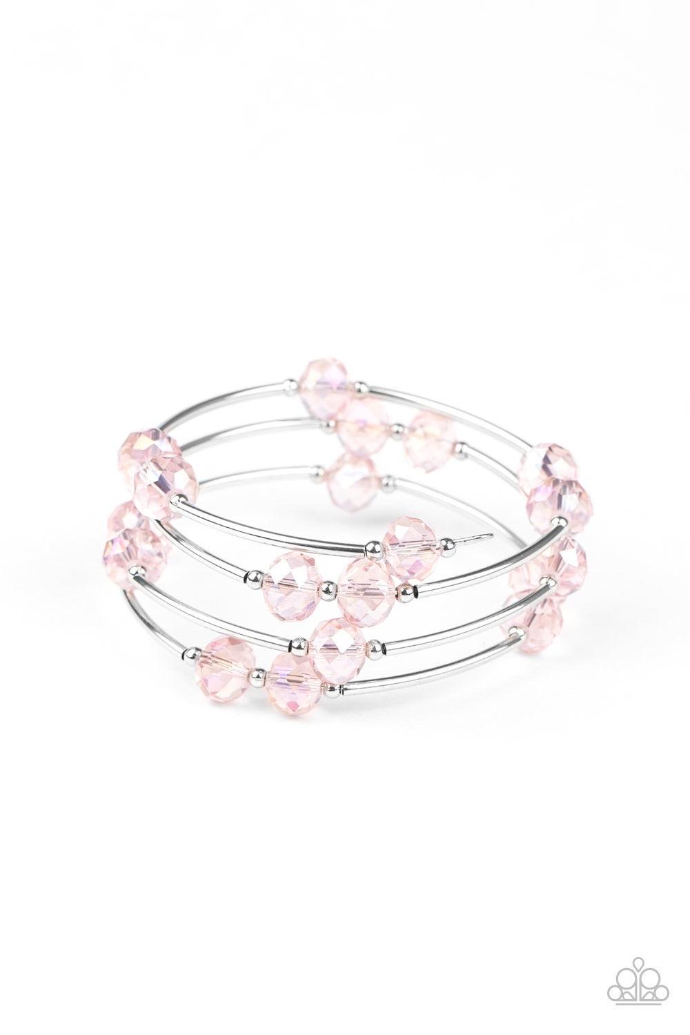 Paparazzi Accessories Dreamy Demure - Pink Glittery pink crystal-like beads, silver rods, and dainty silver beads are threaded along a coiled wire, creating a glamorous infinity wrap style bracelet around the wrist. Sold as one individual bracelet. Jewelr