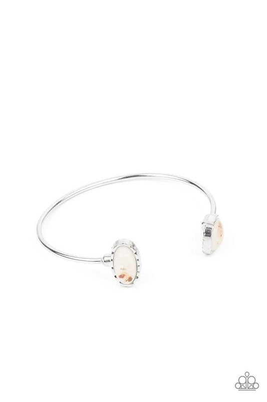 Paparazzi Accessories Don’t BEAD Jealous - White Flecks of iridescent shell-like pieces are encased inside two mismatched glassy white beads at both ends of a dainty silver open-faced cuff. The shimmery beads are encased in imperfectly hammered silver fra