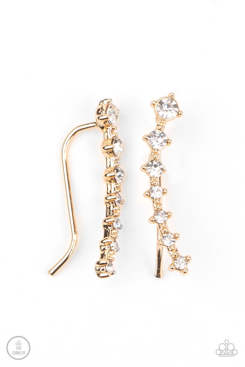 Paparazzi Accessories New Age Nebula - Gold Gradually decreasing in size, a dainty row of glittery white rhinestones curve up the ear for a stellar chic look. Sold as one pair of ear crawlers. Jewelry