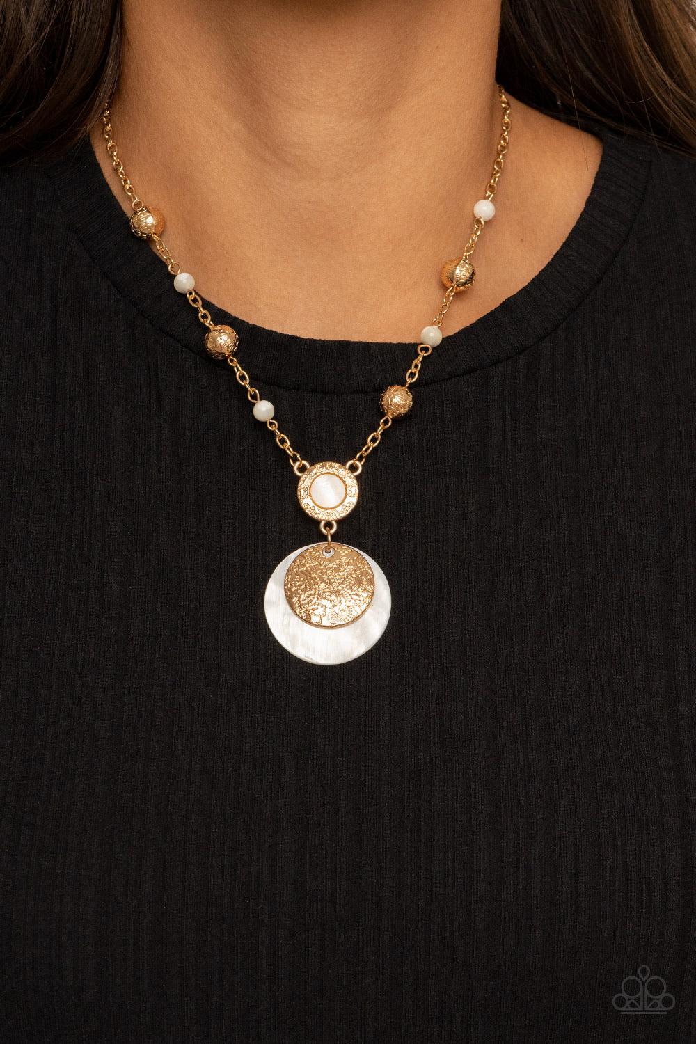 Paparazzi Accessories SEA The Sights - Gold A dainty collection of ornate gold beads and white stone beads dot a dainty gold chain, giving way to a hammered gold ring featuring a shell-like center. A hammered gold disc and white shell-like disc swing from