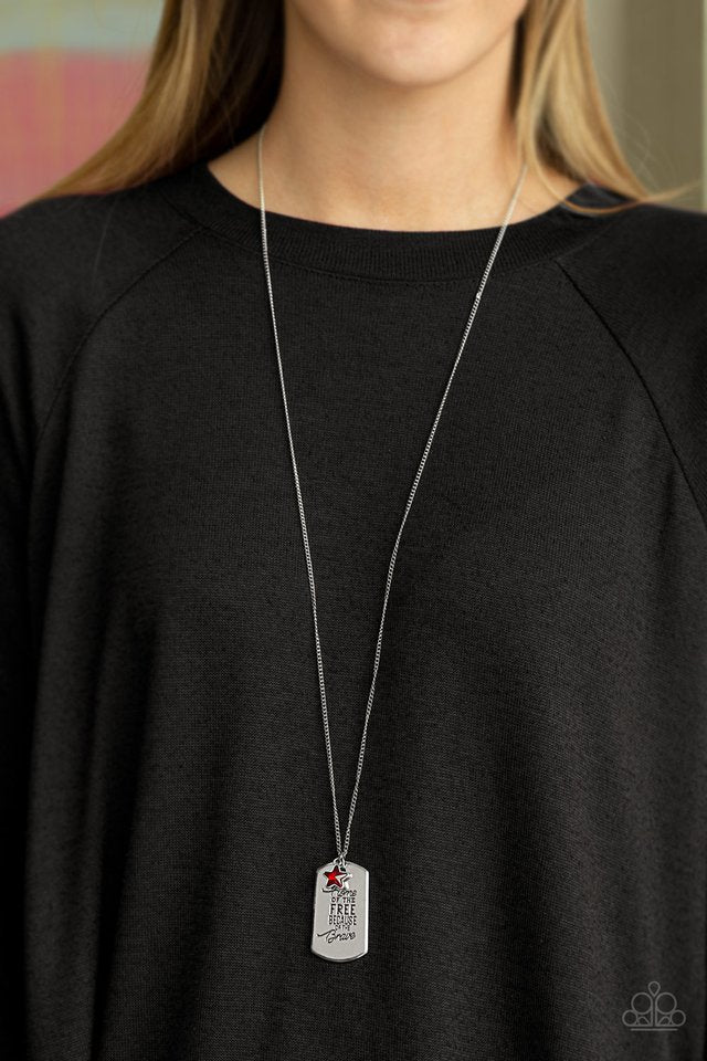 Paparazzi Accessories Home Of The Free - Red Infused with a glittery red rhinestone star charm, a silver dog tag pendant is stamped in the phrase, "Home Of The Free Because Of The Brave", for a whimsical finish. Features an adjustable clasp closure. Sold