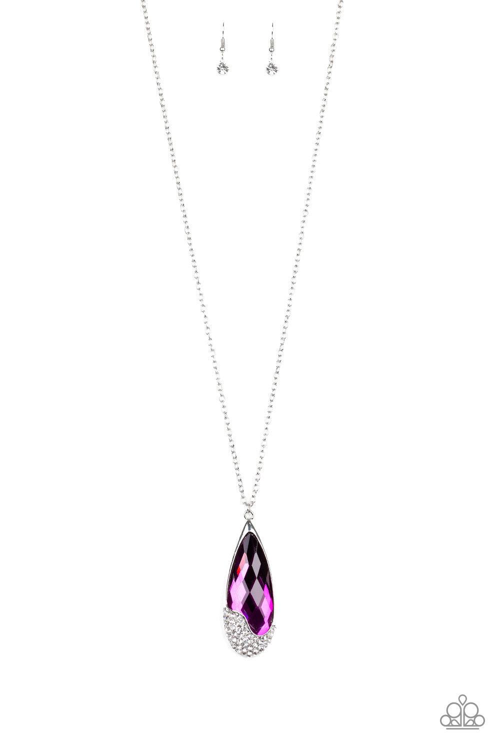 Paparazzi Accessories Spellbound - Purple An oversized purple teardrop gem is nestled inside of an abstract silver frame that has been dipped in glassy white rhinestones. The spellbinding pendant swings from the bottom of a lengthened silver chain for a g