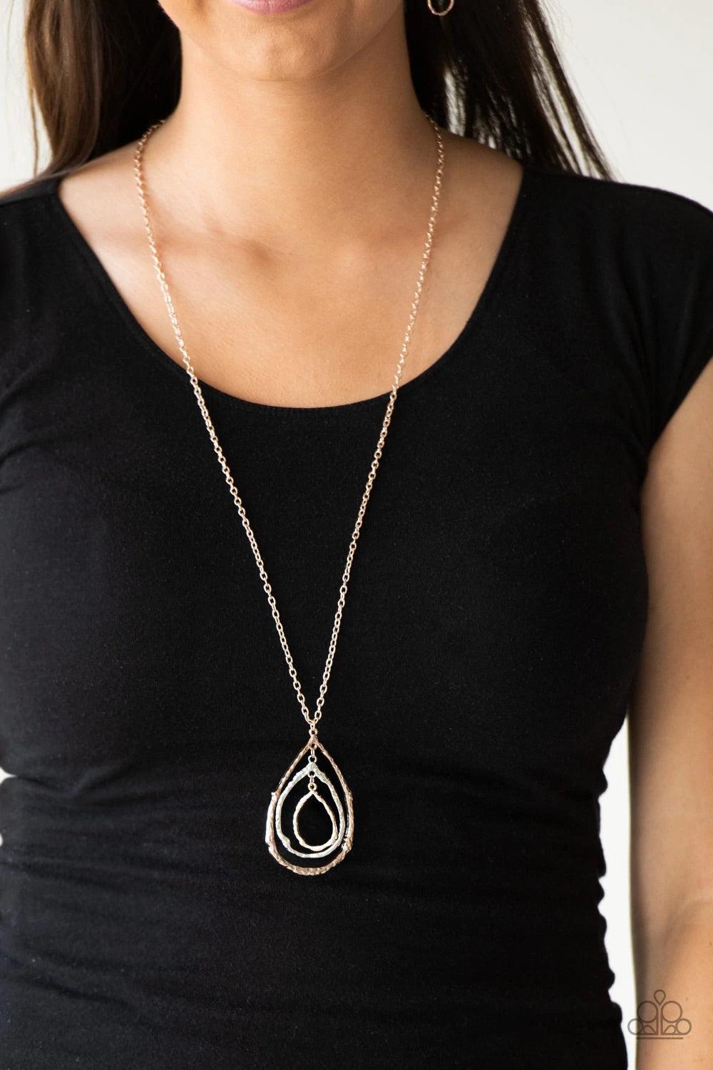 Paparazzi Accessories Going for Grit - Rose Gold Brushed in a high-sheen shimmer, delicately hammered rose gold and silver teardrop silhouettes swing from the bottom of a lengthened rose gold chain for a rustic look. Features an adjustable clasp closure.