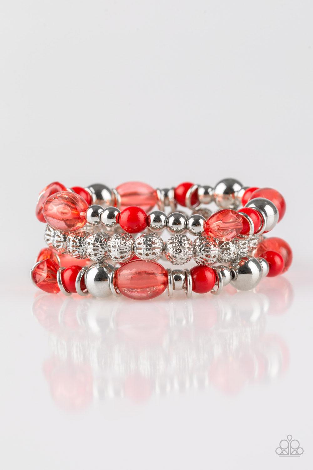 Paparazzi Accessories Malibu Marina - Red An array of glassy and polished red beading and mismatched silver accents are threaded along stretchy elastic bands, creating colorful layers across the wrist. Jewelry
