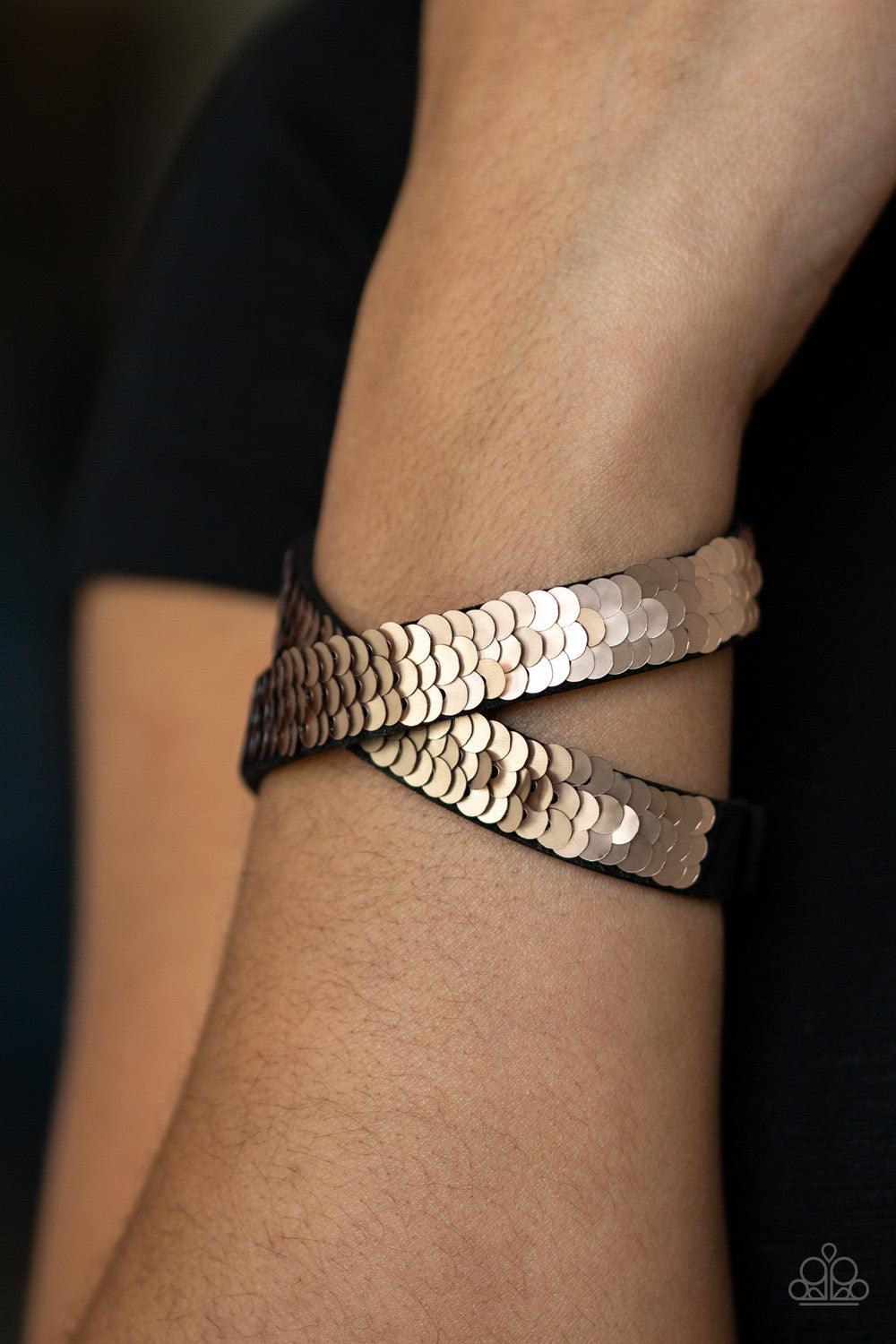 Paparazzi Accessories Under the SEQUINS - Rose Gold Row after row of shimmery sequins are stitched across the front of a lengthened black suede band. The elongated band allows for a trendy double wrap design. Bracelet features reversible sequins that chan