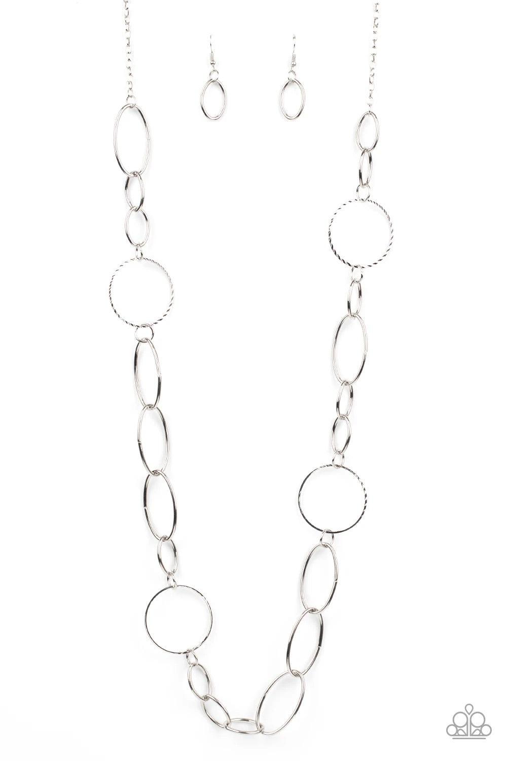 Paparazzi Accessories Perfect Mismatch - Silver An array of smooth and textured silver hoops connect across the chest, creating a bold mismatched palette. Features an adjustable clasp closure. Sold as one individual necklace. Includes one pair of matching