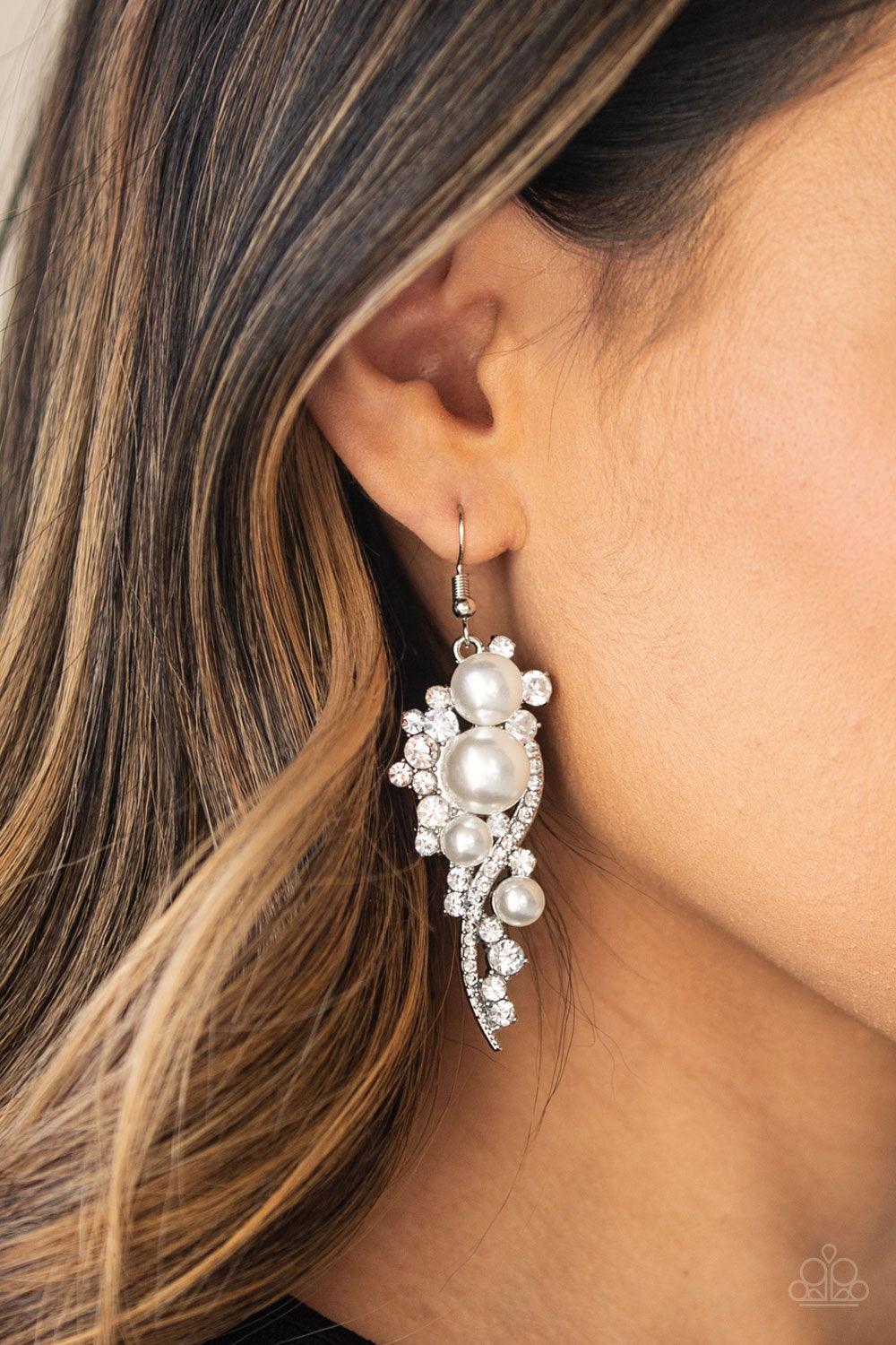 Paparazzi Accessories High-End Elegance - White Bubbly white pearls dot a glistening silver frame interwoven with ribbons of glittery white rhinestones, creating an elegant lure. Earring attaches to a standard fishhook fitting. Jewelry