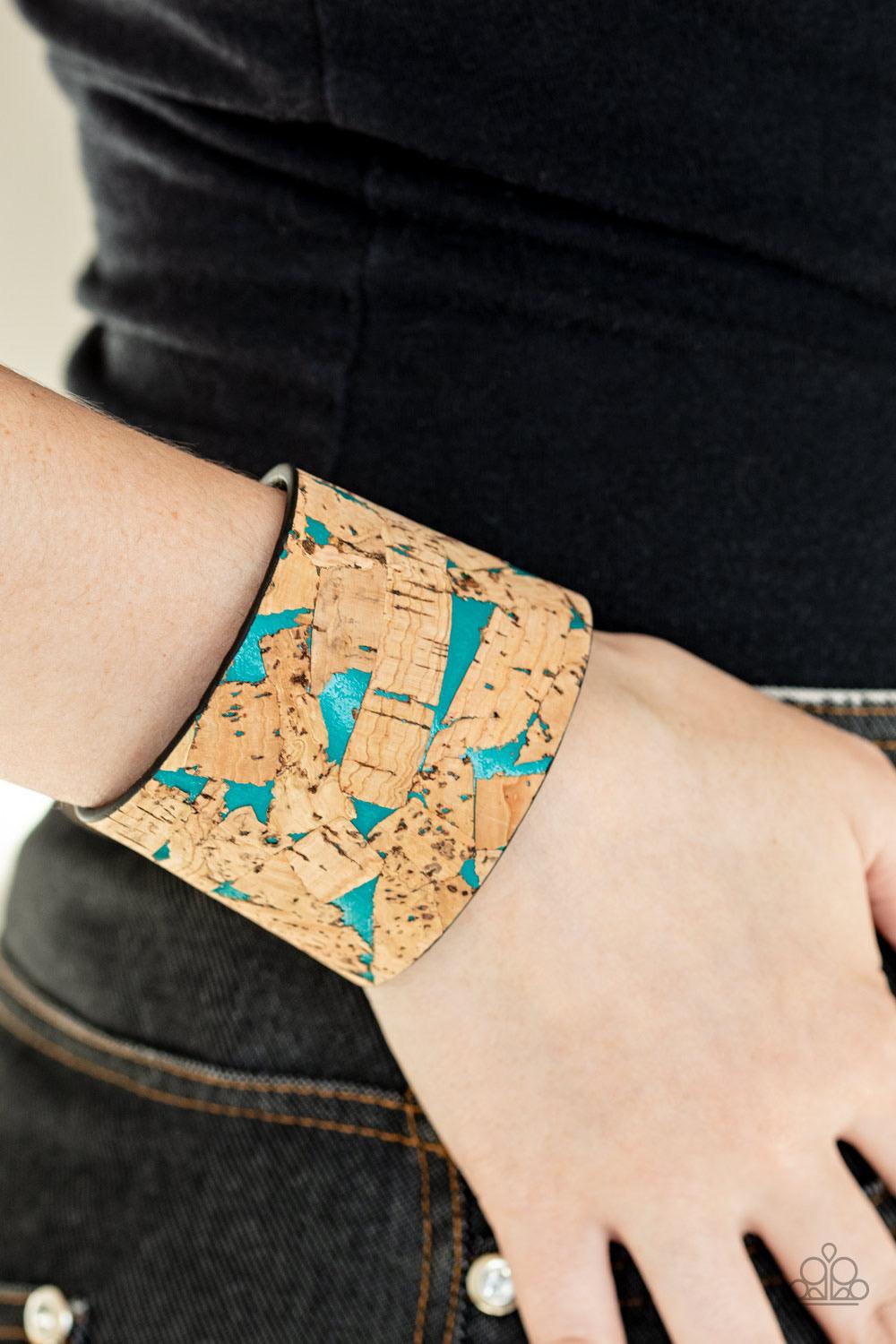 Paparazzi Accessories Cork Congo - Blue Pieces of cork have been plastered across the front of a blue leather band, creating an earthy look around the wrist. Features an adjustable snap closure. Jewelry