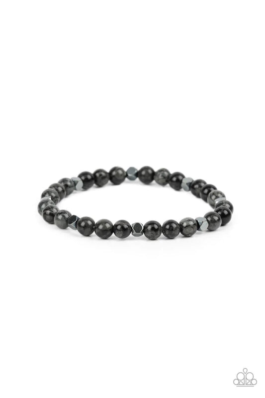 Paparazzi Accessories Interstellar Solitude - Silver A dainty collection of speckled gray stone beads and faceted hematite cube beads are threaded along a stretchy band around the wrist for an earthy flair. Sold as one individual bracelet. Jewelry