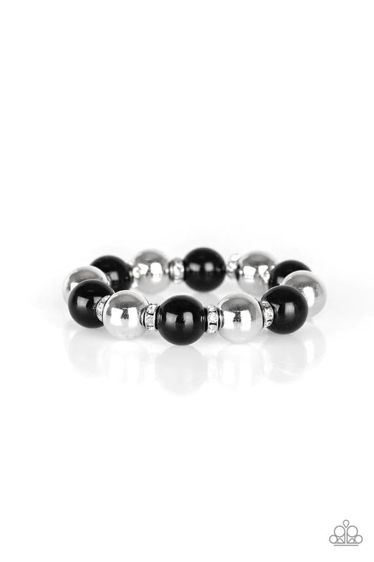 Paparazzi Accessories So Not Sorry - Black A collection of white rhinestone encrusted rings, shiny black beads, and classic silver beads are threaded along a stretchy band around the wrist for a glamorous look. Sold as one individual bracelet. Bracelets