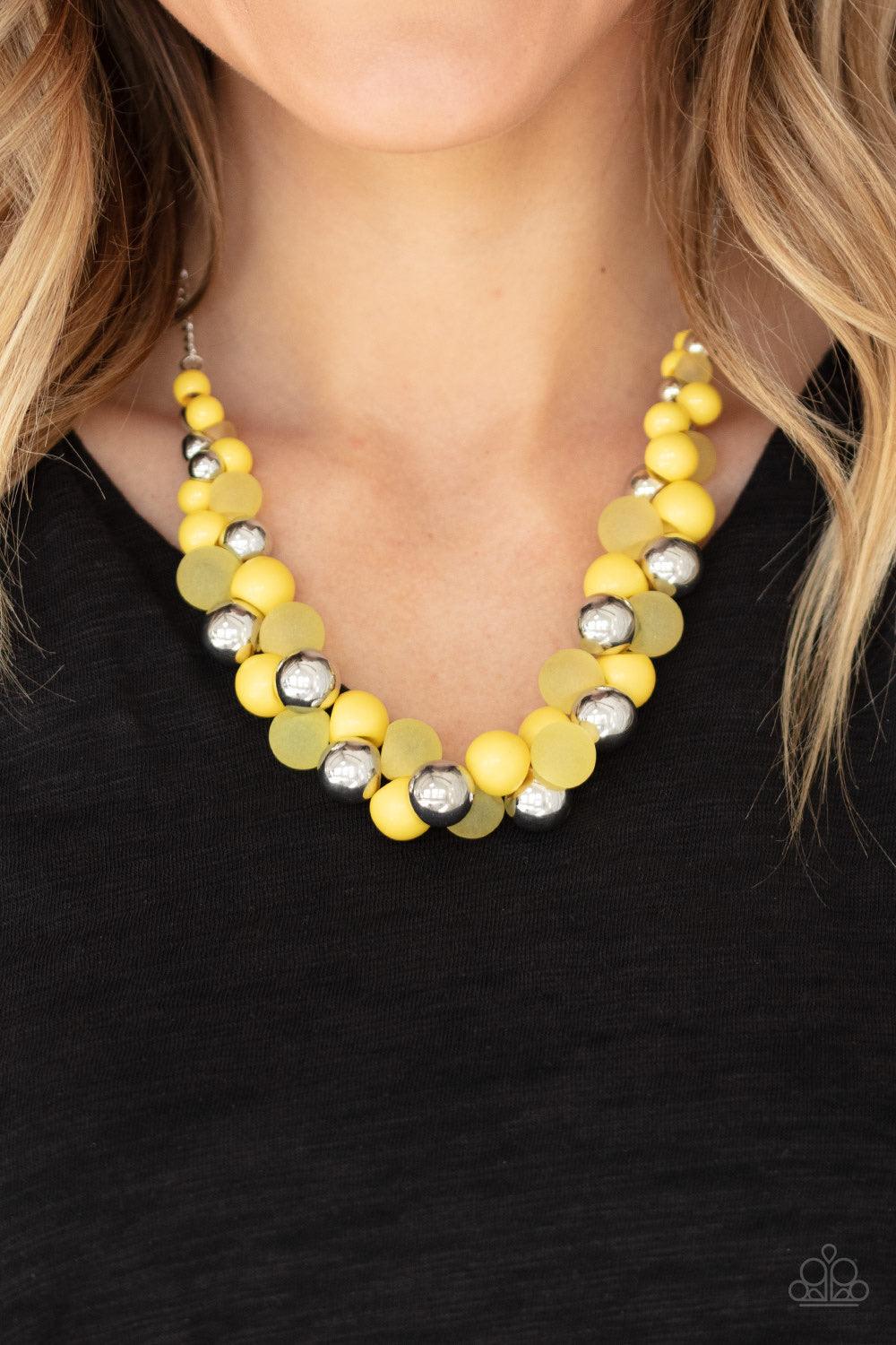 Paparazzi Accessories Bubbly Brilliance - Yellow A bubbly collection of imperfect silver, opaque, and yellow beads are threaded along an invisible wire below the collar, creating a colorful cluster. Features an adjustable clasp closure. Jewelry