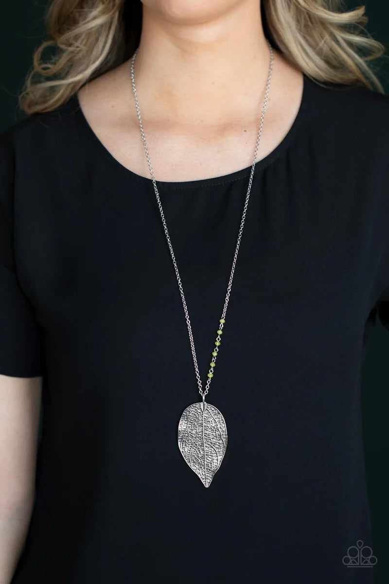 Paparazzi Accessories Frond Fantasy - Yellow One side of a lengthened silver chain is dotted in dainty Illuminating crystal-like beads as it gives way to an oversized leaf pendant embossed in lifelike textures for a seasonal finish. Features an adjustable