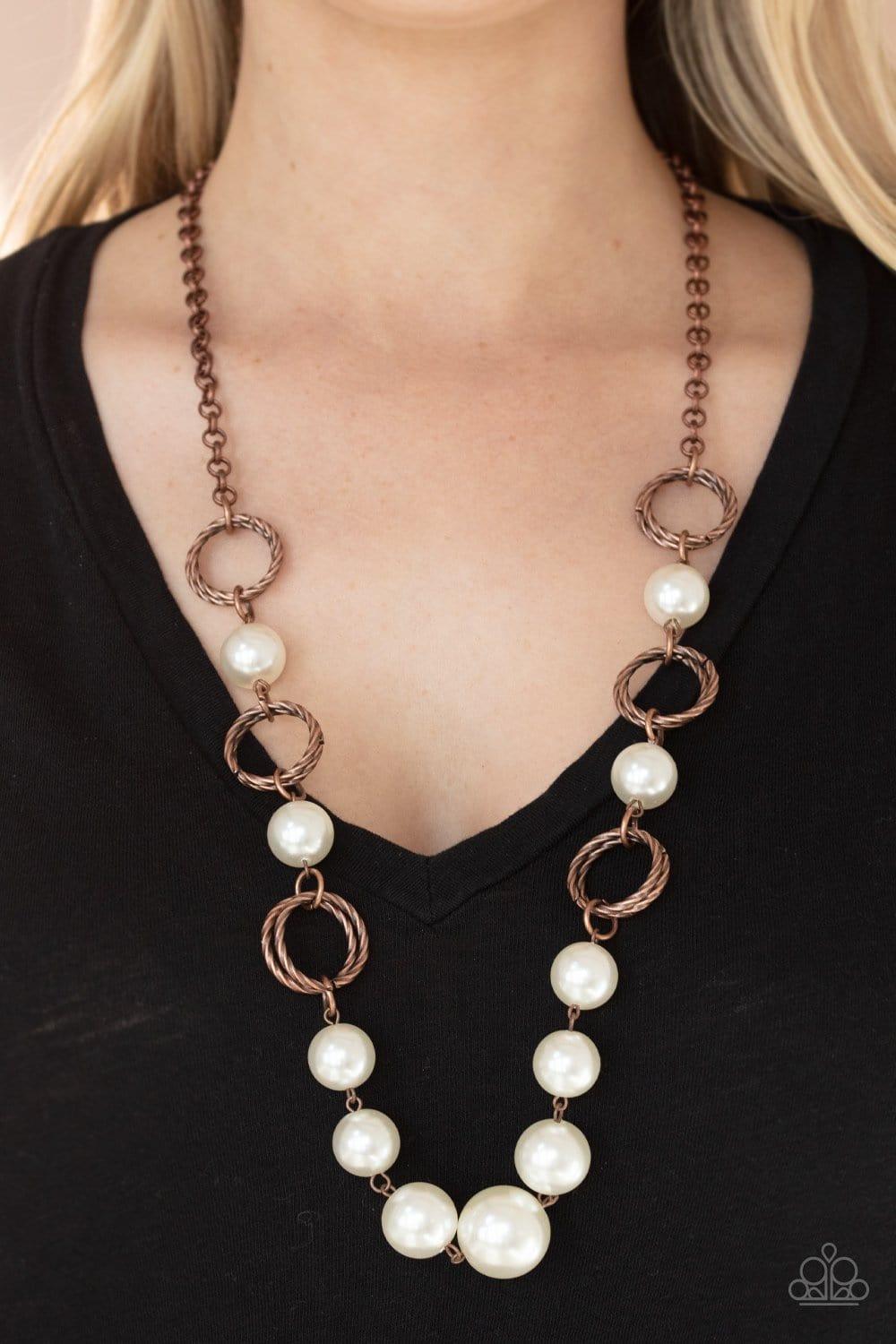 Paparazzi Accessories Countess Me In - Copper A dramatic collection of oversized white pearls and textured copper rings interconnect across the chest, creating a bold display of refinement. Features an adjustable clasp closure. Jewelry