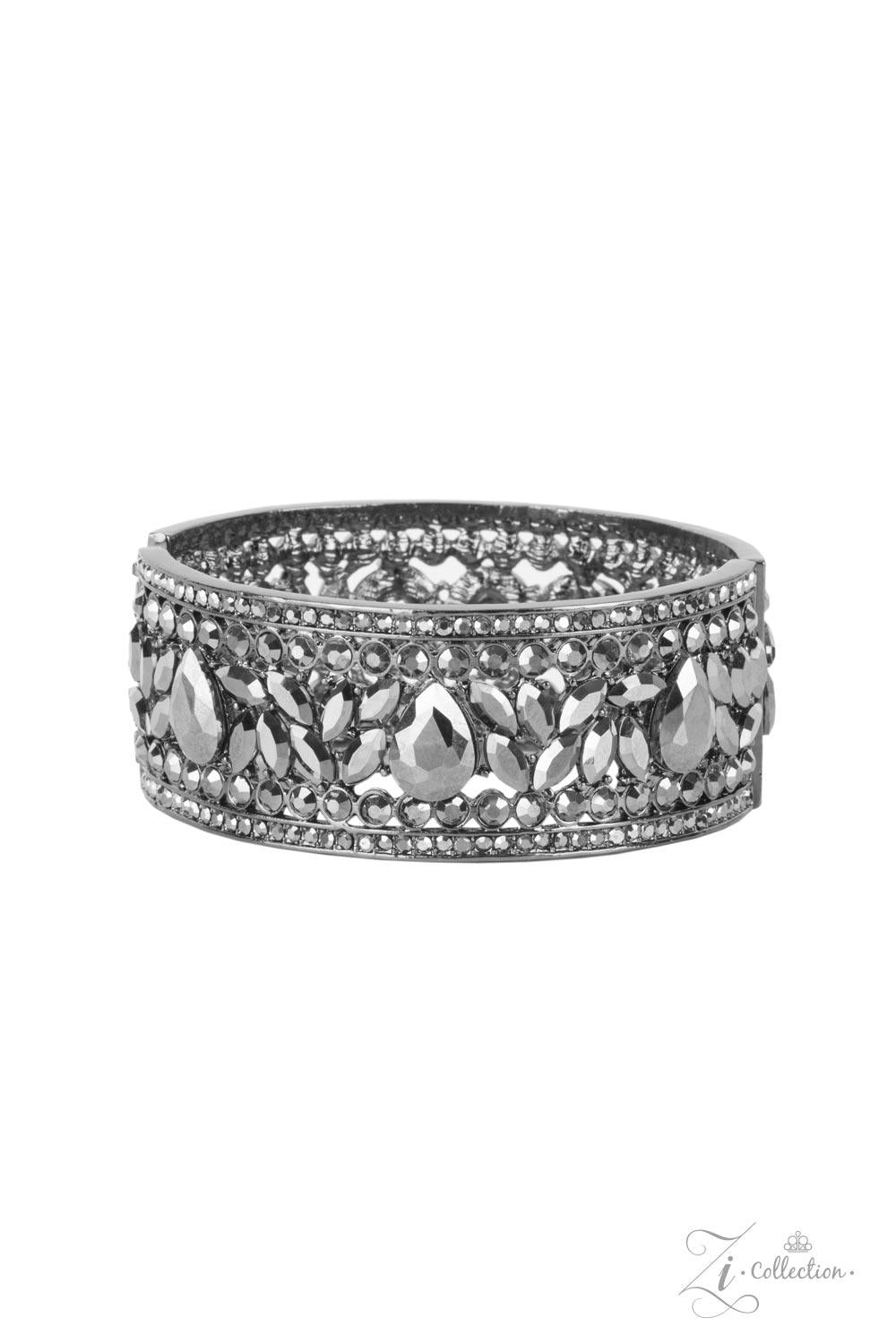 Paparazzi Accessories After Party Powerhouse: ZiCollection A smoldering collection of oversized teardrop and marquise cut hematite rhinestones haphazardly coalesce between linear stacked rows of round hematite rhinestones. The dazzling hematite spangled g