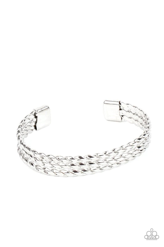 Paparazzi Accessories Line of Scrimmage - Silver Rows of flattened silver wires spin across the front of the wrist, coalescing into an edgy layered cuff. Jewelry