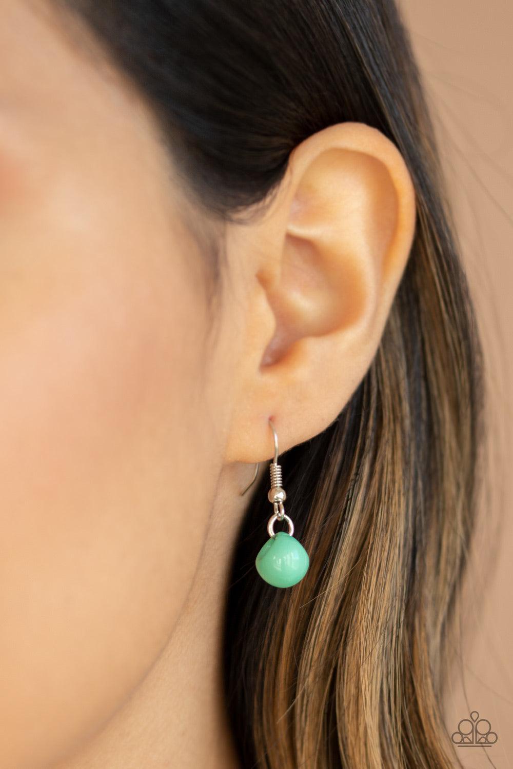 Paparazzi Accessories Bubbly Brilliance - Green A bubbly collection of imperfect silver, opaque, and Biscay Green beads are threaded along an invisible wire below the collar, creating a colorful cluster. Features an adjustable clasp closure. Jewelry