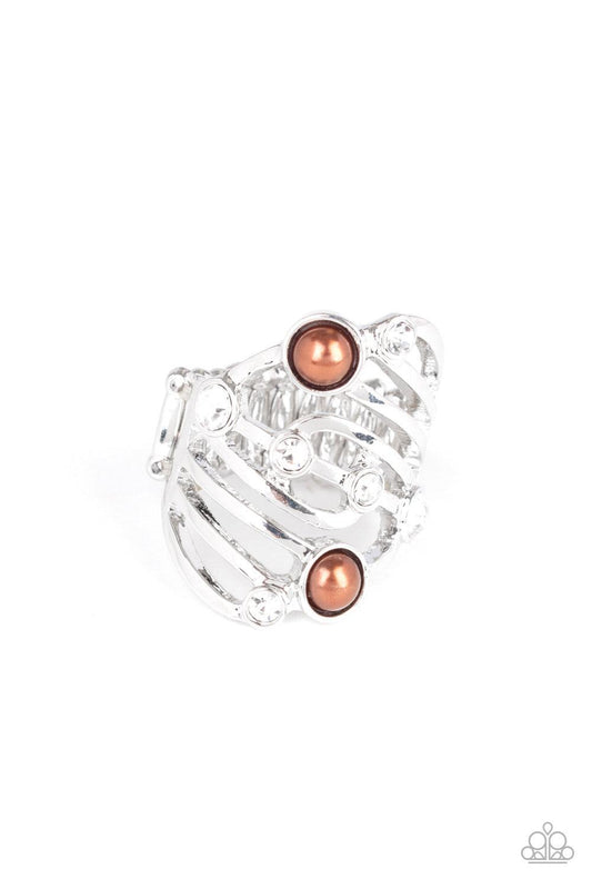 Paparazzi Accessories Dancing Diamonds - Brown Dotted in glassy white rhinestones and dainty brown pearls, whirling silver bands stack across the finger for a refined layered look. Features a stretchy band for a flexible fit. Jewelry