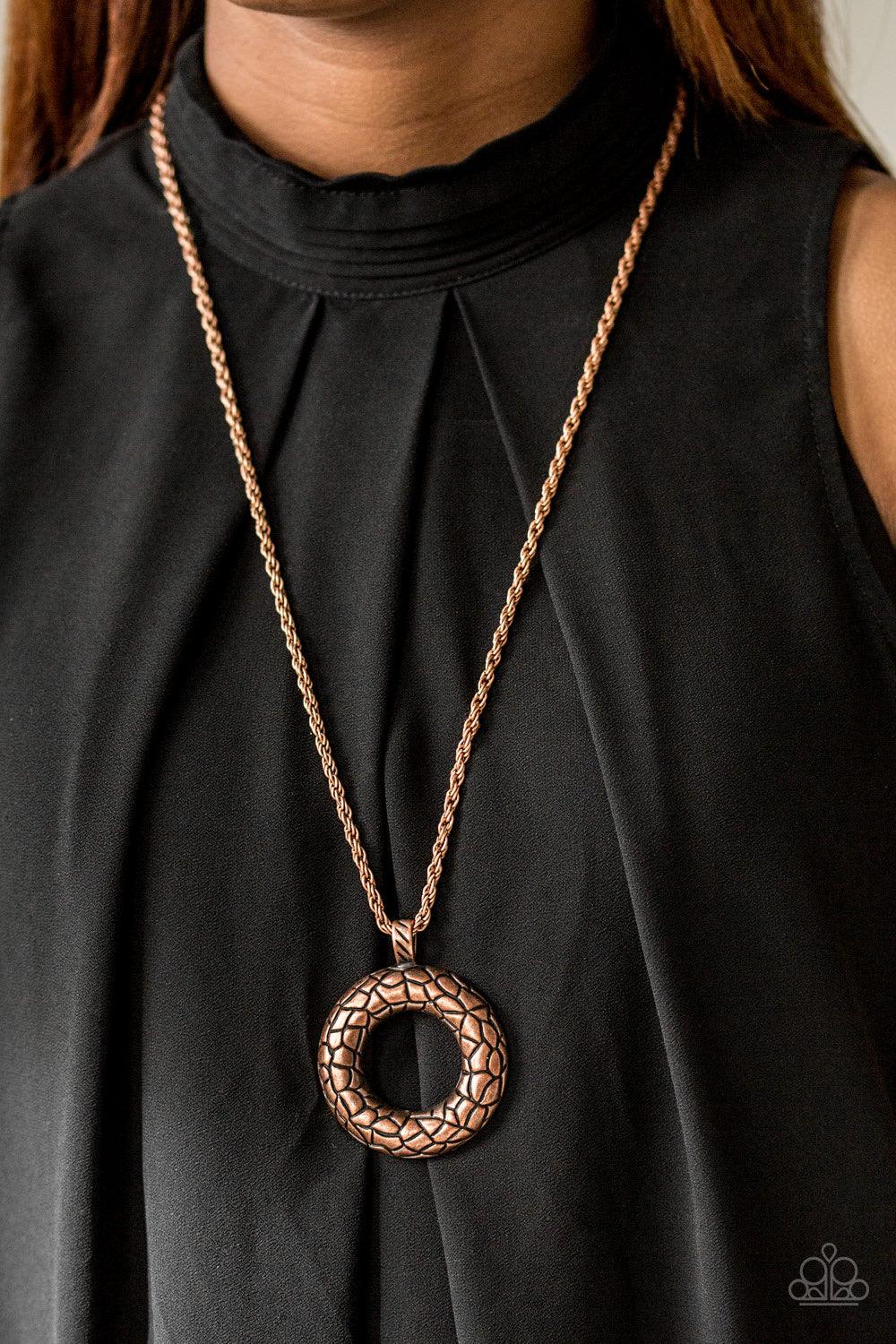 Paparazzi Accessories Pretty as a Prowess - Copper Embossed in a metallic stone pattern, a bold copper frame swings from the bottom of a glistening copper chain for an edgy look. Features an adjustable clasp closure. Sold as one individual necklace. Inclu