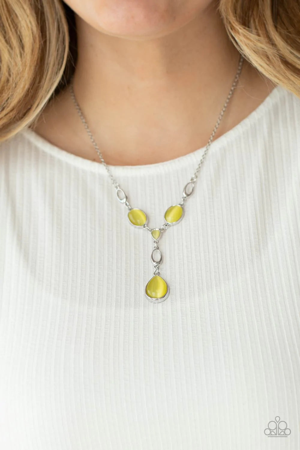Paparazzi Accessories Ritzy Refinement - Yellow Smoldering yellow cat's eye stones and silver accents delicately link across the collar. A stunning yellow cat's eye teardrop pendant swings from a silver loop for a sophisticated and refined finish. Feature