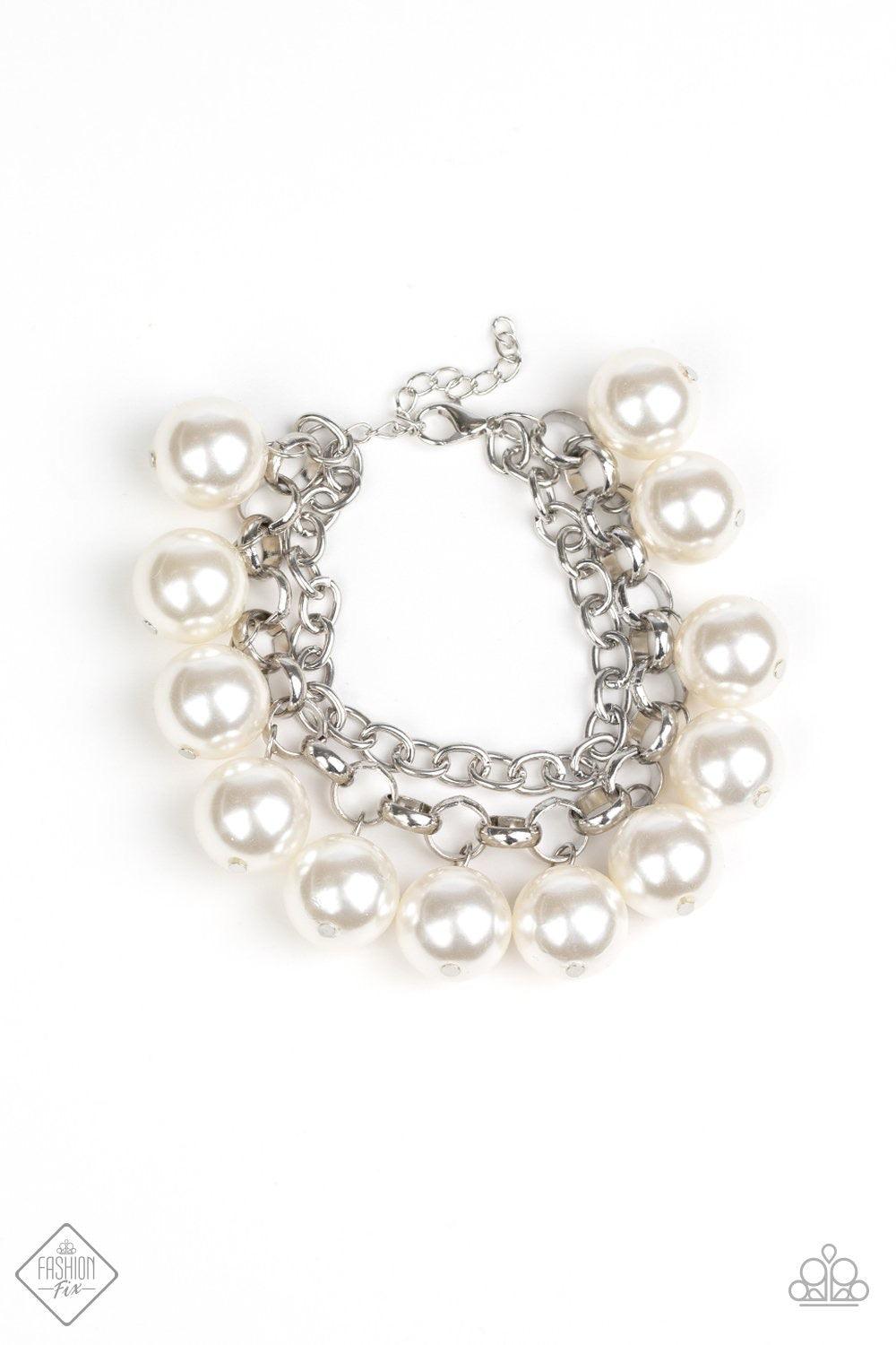 Paparazzi Accessories One-Way Wallstreet ~White A simple square-link chain runs parallel with a chunky silver chain that has been decorated in over sized white pearls that dangle from the wrist, creating a dramatic fringe. Features an adjustable clasp clo